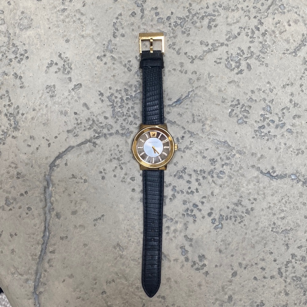 SWAROVSKI big face crystal/goldtone watch w/leather strap